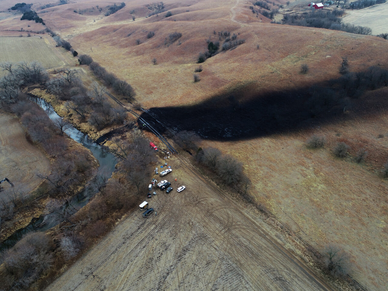 In this photo taken by a drone, cleanup continues in the area where the ruptured Keystone pipeline dumped oil into a creek in Washington County, Kan., Friday, Dec. 9, 2022. (DroneBase via AP)