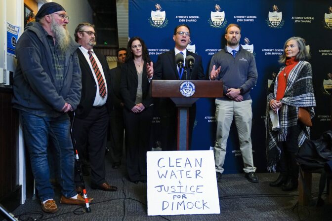 Pennsylvania Attorney General Josh Shapiro, center, speaks with members of the media during a news conference at the Susquehanna County District Courthouse in Montrose, Pa., on Nov. 29, 2022.