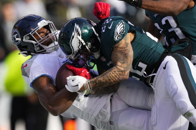 Tennessee Titans' Treylon Burks scores a touchdown in front of Philadelphia Eagles' Marcus Epps during the first half of an NFL football game, Sunday, Dec. 4, 2022, in Philadelphia.