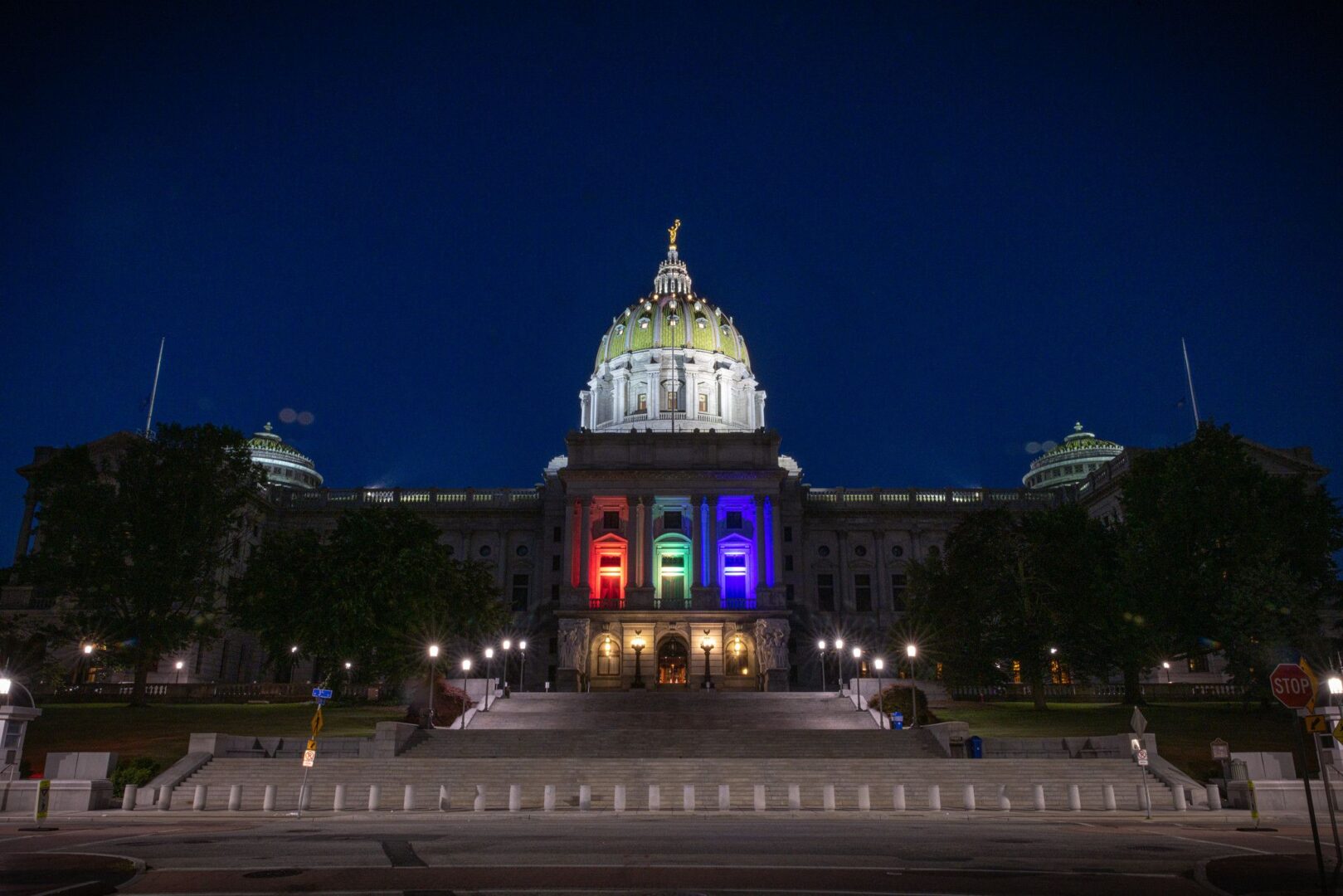 LGBTQ pride colors are displayed on the state Capitol in Harrisburg, Pennsylvania.