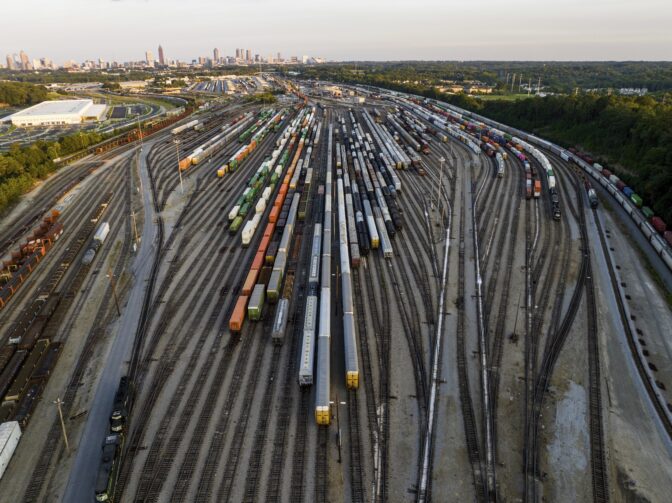 Freight train cars sit in a Norfolk Southern rail yard on Sept. 14, 2022, in Atlanta. Business groups are increasing the pressure on lawmakers to intervene and block a railroad strike before next month's deadline in the stalled contract talks.