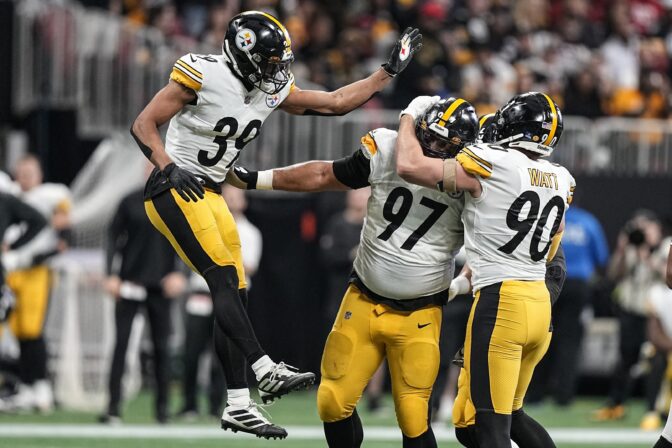Pittsburgh Steelers safety Minkah Fitzpatrick (39) defensive tackle Cameron Heyward (97) and linebacker T.J. Watt (90) celebrate the sacking of Atlanta Falcons quarterback Marcus Mariota during the first half of an NFL football game, Sunday, Dec. 4, 2022, in Atlanta.