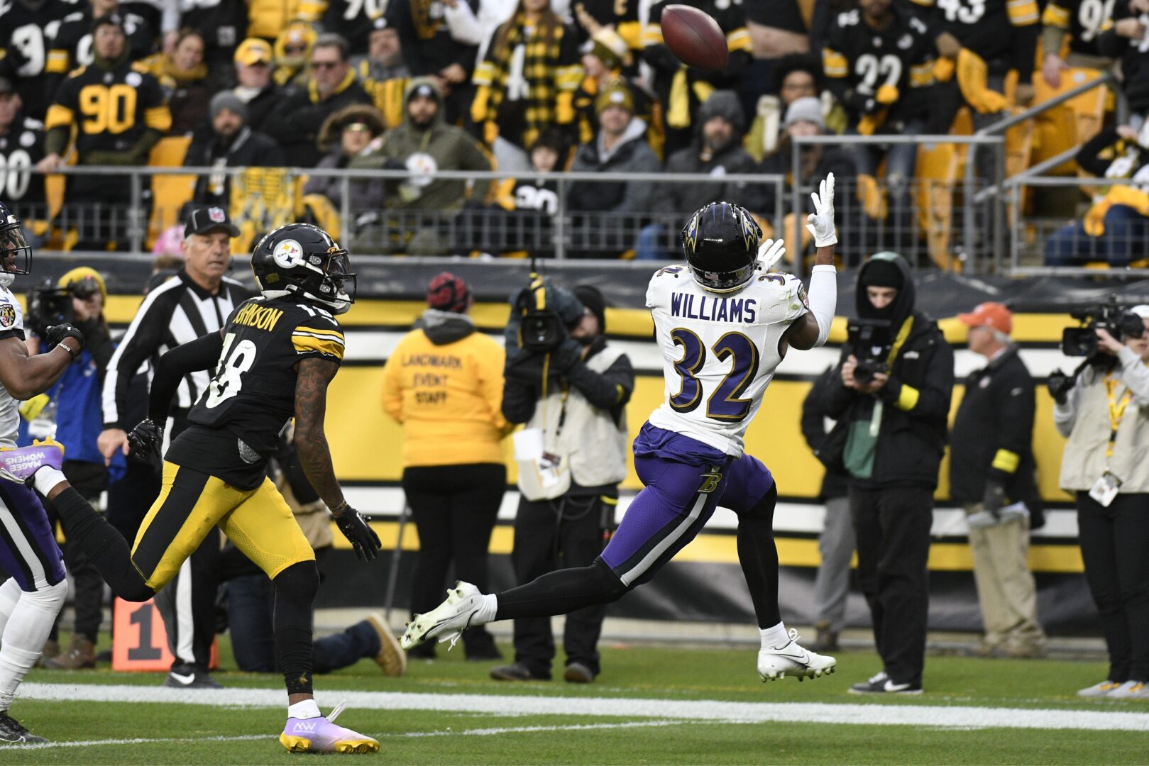 Baltimore Ravens safety Marcus Williams (32) intercepts a pass intended for Pittsburgh Steelers wide receiver Diontae Johnson during the second half of an NFL football game in Pittsburgh, Sunday, Dec. 11, 2022. 