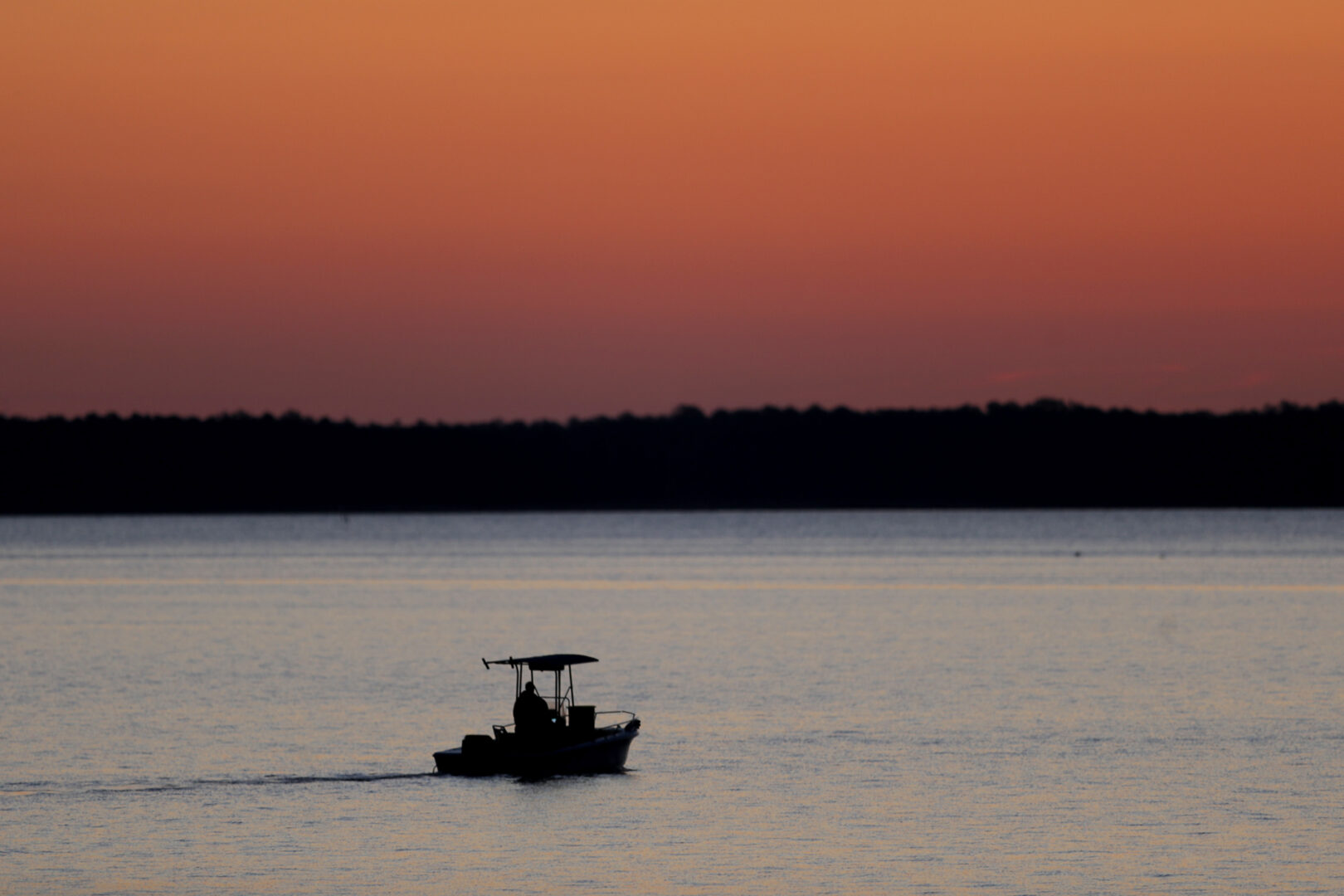 FILE - A small boat travels along the Honga River near the Chesapeake Bay, as the sky lights up at sunrise in Fishing Creek, Md., May 14, 2020. In an evaluation released on Thursday, Jan. 5, 2023, the Chesapeake Bay Foundation, an environmental group, gave the Chesapeake Bay watershed a D-plus grade, the same grade it gave the watershed in its last report in 2020.