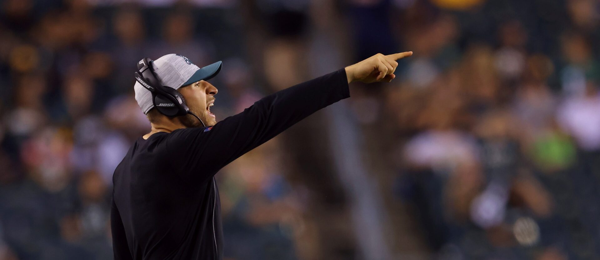 FILE - Philadelphia Eagles linebackers coach Nick Rallis gestures during a preseason NFL football game against the Pittsburgh Steelers, Thursday, Aug. 12, 2021, in Philadelphia. It's a big weekend for Nick Rallis and big brother Mike. Mike Rallis, better known as WWE star Madcap Moss, is in the mix for Saturday's Royal Rumble. (AP Photo/Rich Schultz, File)