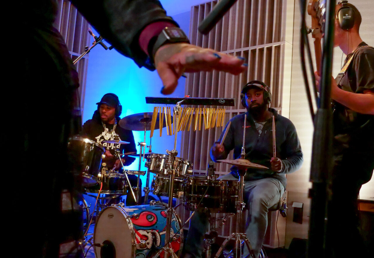 Drummers Hustle and Kieran Benton performing with Sir Dominiqaue Jordan and The Prolific Steppas.