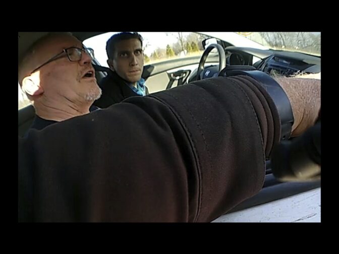 In this cropped screen grab from a bodycam video provided by the Hancock County Sheriff's Office, Bryan Kohberger, left, and his father are seen talking to a sheriff's deputy during a traffic stop on Thursday, Dec. 15, 2022, in Hancock County, Ind.