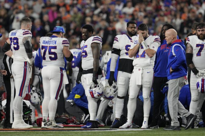 Buffalo Bills' Damar Hamlin is examined during the first half of an NFL football game against the Cincinnati Bengals, Monday, Jan. 2, 2023, in Cincinnati.