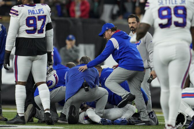 Buffalo Bills' Damar Hamlin is examined during the first half of an NFL football game against the Cincinnati Bengals, Monday, Jan. 2, 2023, in Cincinnati.