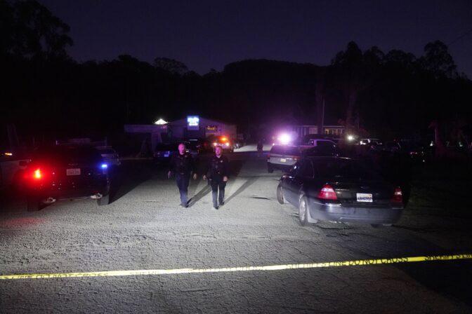 Law enforcement personnel control the scene of a shooting Monday, Jan. 23, 2023, in Half Moon Bay, Calif. Multiple people were killed in two related shootings Monday at a mushroom farm and a trucking firm in a coastal community south of San Francisco, and officials say a suspect is in custody.