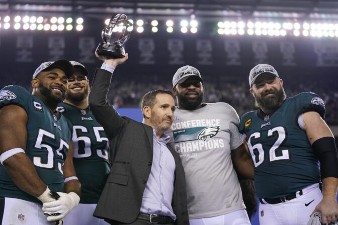 Philadelphia Eagles general manager Howie Roseman, center, stands with defensive end Brandon Graham (55) offensive tackle Lane Johnson (65), defensive tackle Fletcher Cox, and center Jason Kelce (62) after the NFC Championship NFL football game between the Philadelphia Eagles and the San Francisco 49ers on Sunday, Jan. 29, 2023, in Philadelphia. The Eagles won 31-7.