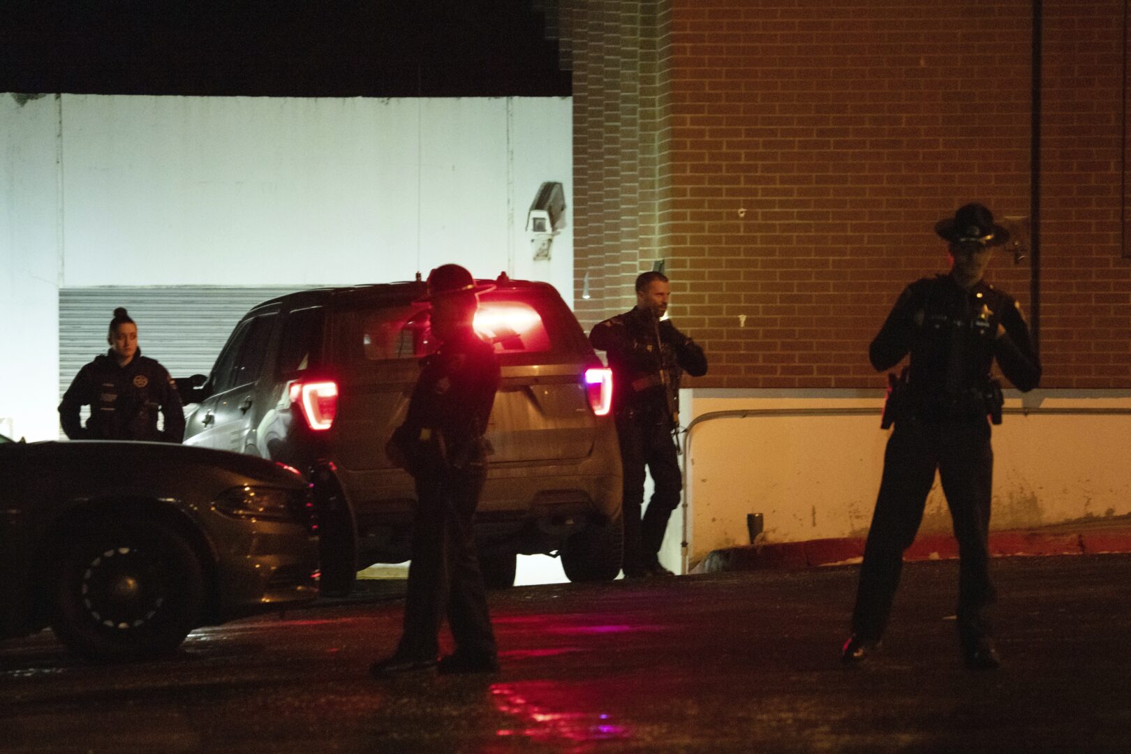 Law enforcement personnel stand guard next to a garage entrance at the Latah County Courthouse after Bryan Kohberger, who is accused of killing four University of Idaho students in November 2022, arrived in a police motorcade at the courthouse, Wednesday, Jan. 4, 2023, in Moscow, Idaho, following his extradition from Pennsylvania.
