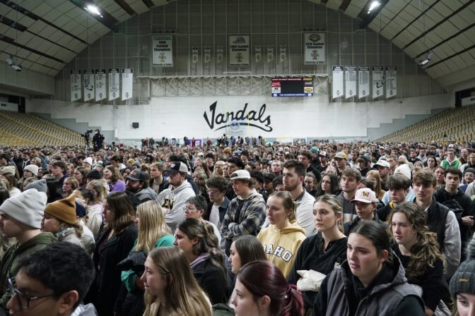 People, attending a vigil for the four University of Idaho students who were killed on Nov. 13, 2022, stand in the Kibbie Dome as family members talk about their loved ones on Nov. 30, 2022, in Moscow, Idaho.