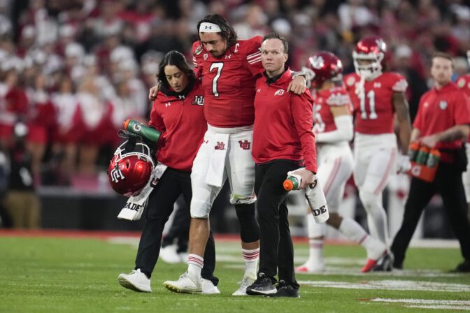 Utah quarterback Cameron Rising (7) is helped off the field during the second half in the Rose Bowl NCAA college football game against Penn State Monday, Jan. 2, 2023, in Pasadena, Calif.
