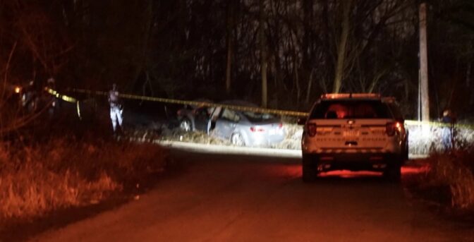 Pittsburgh Police monitor the scene of a car crash in Homewood North on Monday night. The driver, who police called a suspect in the fatal shooting of Brackenridge Police Chief Justin McIntire and the wounding of a second officer, ran from the car. Pittsburgh police shot and killed him after he opened fire at them, according to Allegheny County and Pittsburgh Police officials.