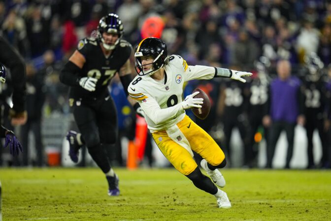 Pittsburgh Steelers quarterback Kenny Pickett (8) scrambles against the Baltimore Ravens in the second half of an NFL football game in Baltimore, Fla., Sunday, Jan. 1, 2023.