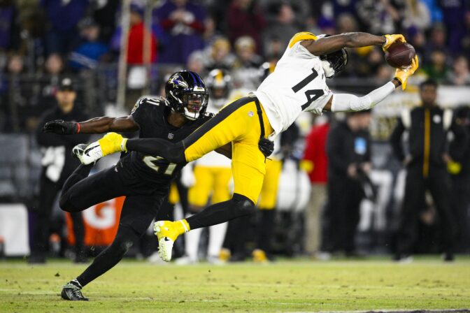 Pittsburgh Steelers wide receiver George Pickens (14) makes a catch in front of Baltimore Ravens cornerback Brandon Stephens (21) in the second half of an NFL football game in Baltimore, Fla., Sunday, Jan. 1, 2023.