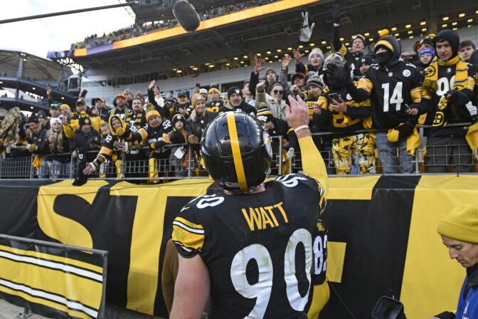 Pittsburgh Steelers linebacker T.J. Watt (90) tosses a glove to fans as he heads to the locker room following an NFL football game against the Cleveland Browns in Pittsburgh, Sunday, Jan. 8, 2023.