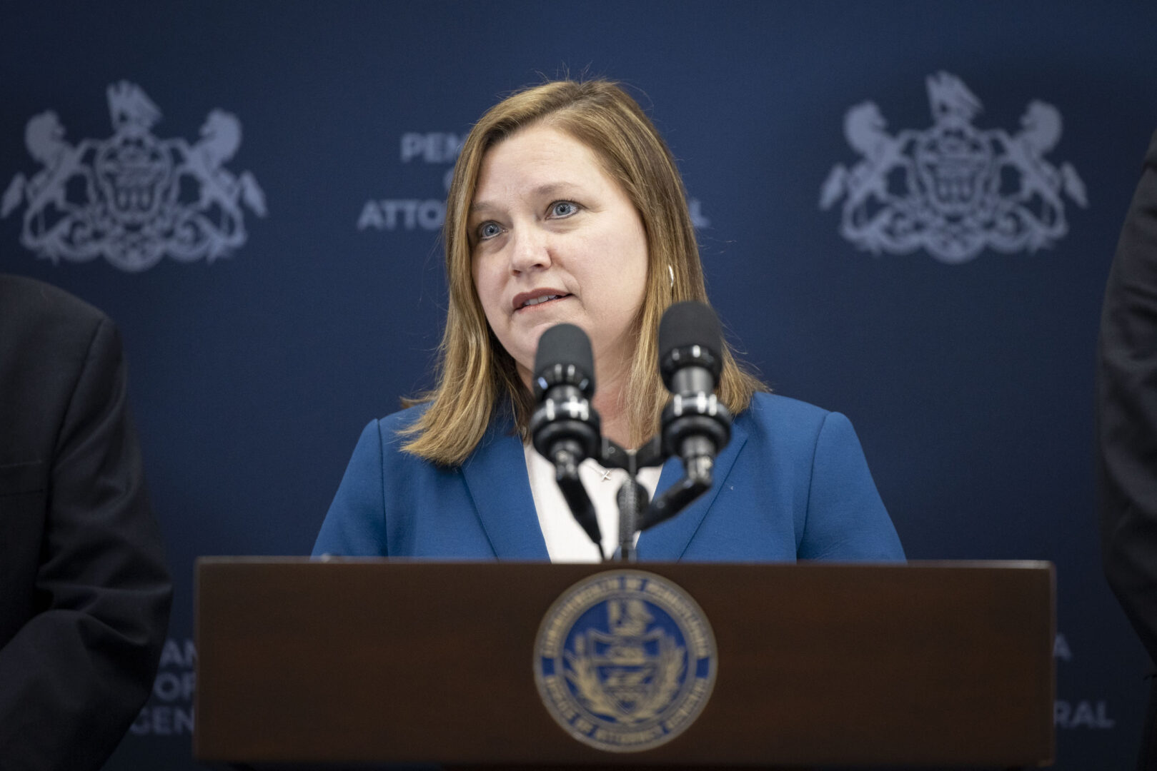 Acting Attorney General of Pennsylvania Michelle Henry announces sexual abuse charges against five men at a press conference in Harrisburg on Feb. 7, 2023.