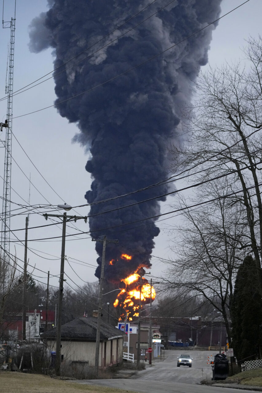 A black plume rises over East Palestine, Ohio, as a result of the controlled detonation of a portion of the derailed Norfolk and Southern trains Monday, Feb. 6, 2023.