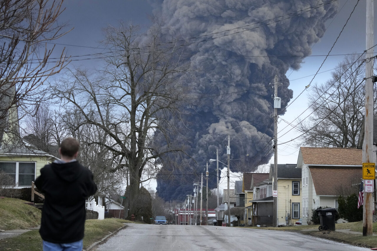 A black plume rises over East Palestine, Ohio, as a result of the controlled detonation of a portion of the derailed Norfolk and Southern trains Monday, Feb. 6, 2023.