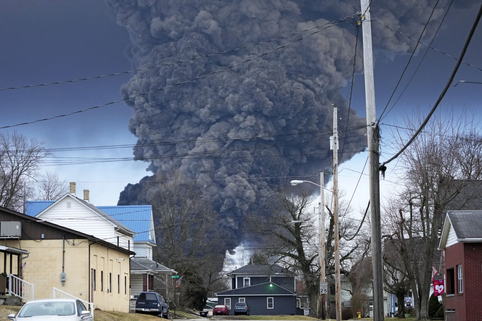 A black plume rises over East Palestine, Ohio, as a result of a controlled detonation of a portion of the derailed Norfolk and Southern trains Monday, Feb. 6, 2023. 