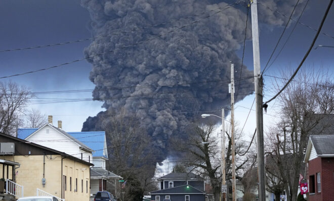 A black plume rises over East Palestine, Ohio, as a result of a controlled detonation of a portion of the derailed Norfolk and Southern trains Monday, Feb. 6, 2023. 