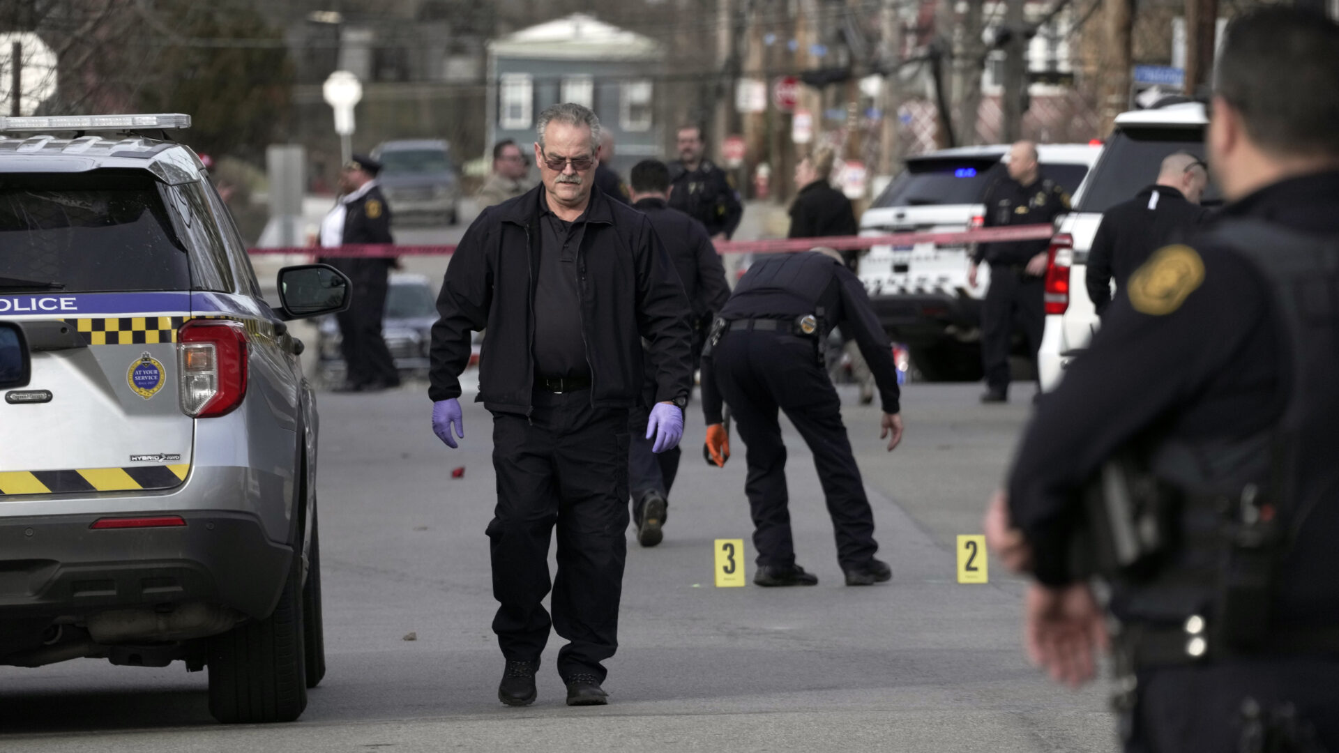 The Pittsburgh Police Crime Scene Investigation unit works the scene outside Westinghouse Academy where Pittsburgh Public Safety and school officials said four students were shot as school was dismissed, Tuesday, Feb. 14, 2023, in the Homewood neighborhood of Pittsburgh. No life-threatening injuries have been reported, police said. 