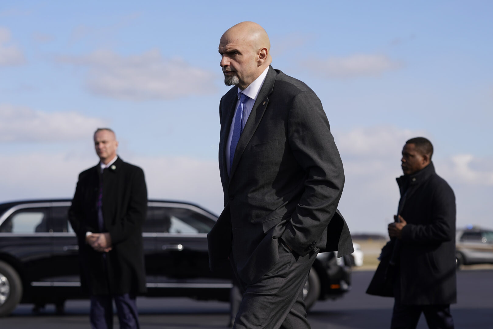 FILE - Sen. John Fetterman, D-Pa., walks to a motorcade vehicle after stepping off Air Force One behind President Joe Biden, Feb. 3, 2023, at Philadelphia International Airport in Philadelphia. On Thursday, Feb. 16, Fetterman's office announced that the senator had checked himself into the hospital for clinical depression.
