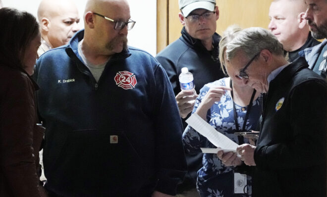 Ohio Governor Mike DeWine, right, prepares to meet with reporters after touring the Norfolk and Southern train derailment site in East Palestine, Ohio, Monday, Feb. 6, 2023. 