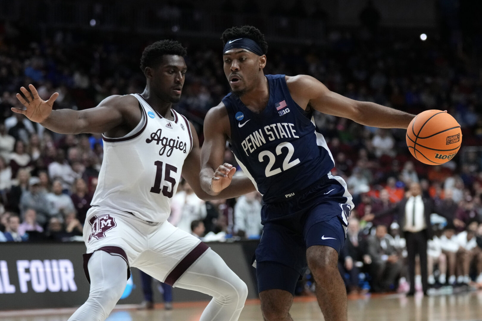 Penn State guard Jalen Pickett (22) drives past Texas A&M forward Henry Coleman III (15) in the second half of a first-round college basketball game in the NCAA Tournament, Thursday, March 16, 2023, in Des Moines, Iowa. (AP Photo/Charlie Neibergall)