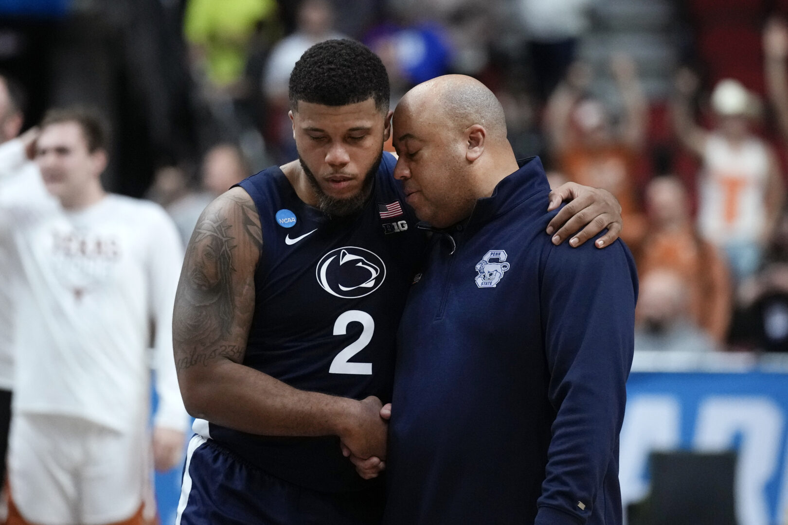Penn State head coach Micah Shrewsberry walks off the court with guard Myles Dread (2) after a second-round college basketball game against Texas in the NCAA Tournament, Saturday, March 18, 2023, in Des Moines, Iowa. (AP Photo/Charlie Neibergall)