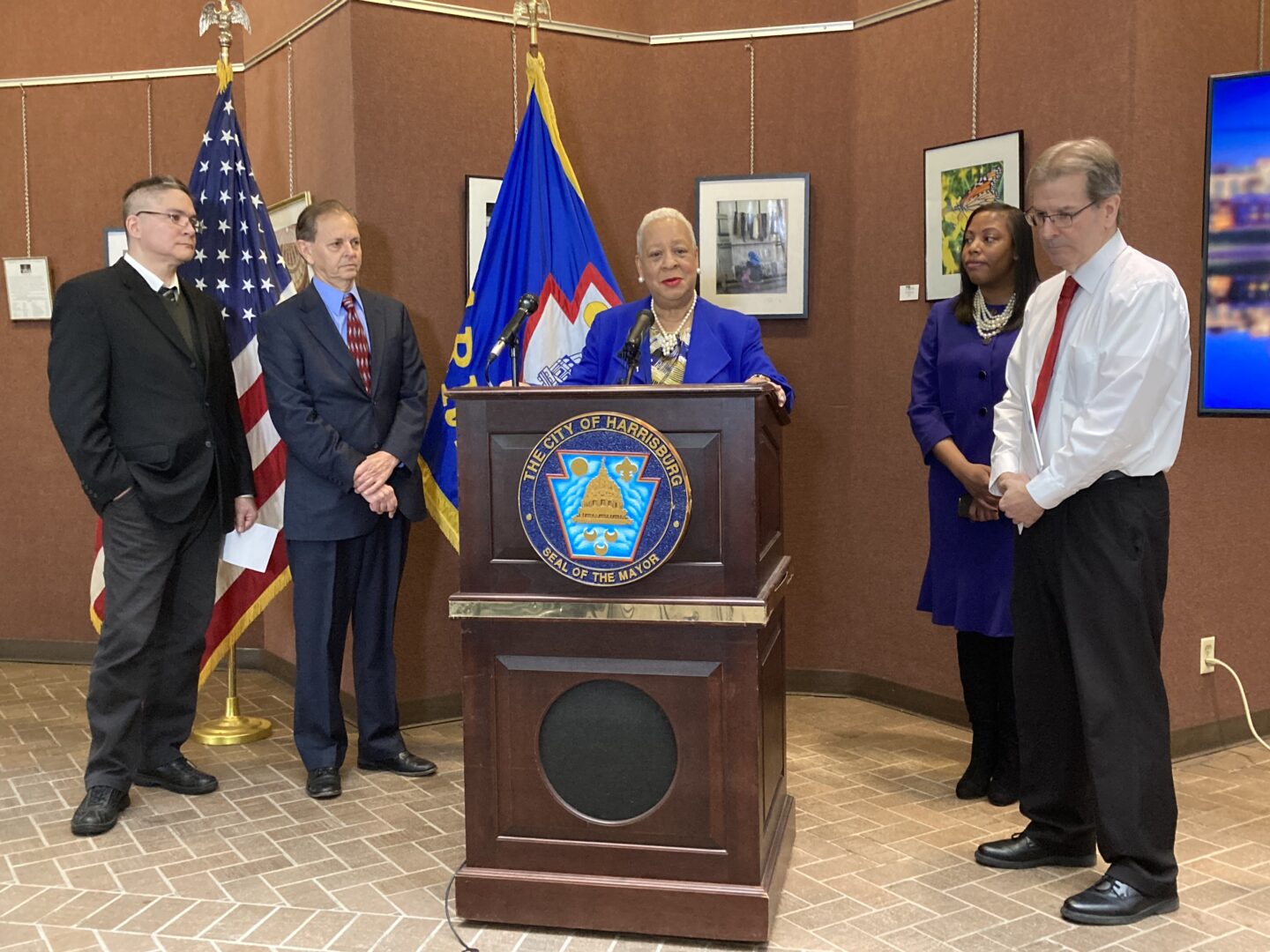 Harrisburg Mayor Wanda Williams (center), flanked by city leaders, speak a press conferencing announcing a bond insurance debt payment at the Rev. Dr. Martin Luther King, Jr. City Government Center on March 16, 2023.