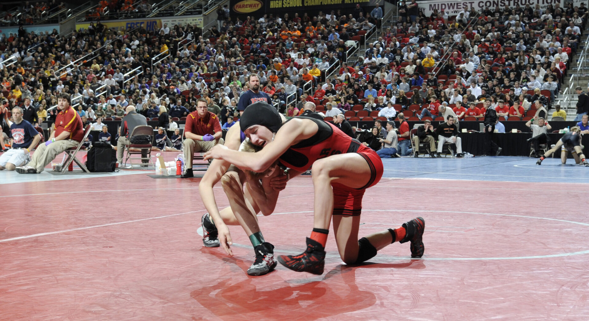 Cassy Herkelman of Cedar Falls, right, wrestles Matt Victor of Indianola in a 112-pound Class 3A quarterfinal match Friday, February 18, 2011 in Des Moines, Iowa.  Herkelman lost 5-1 to Victor on points.  (AP Photo/Steve Pope)