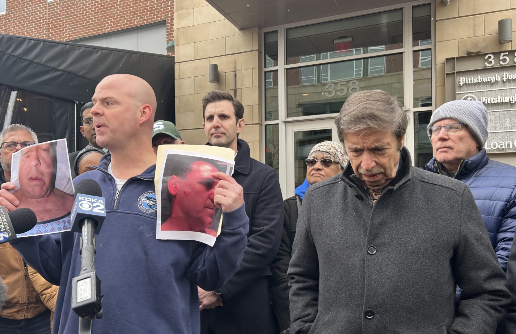 Standing alongside Democratic elected officials, Allegheny County Labor Council President Darrin Kelly calls on local authorities to investigate a punching incident outside the Post-Gazette's South Side distribution facility Saturday night.
