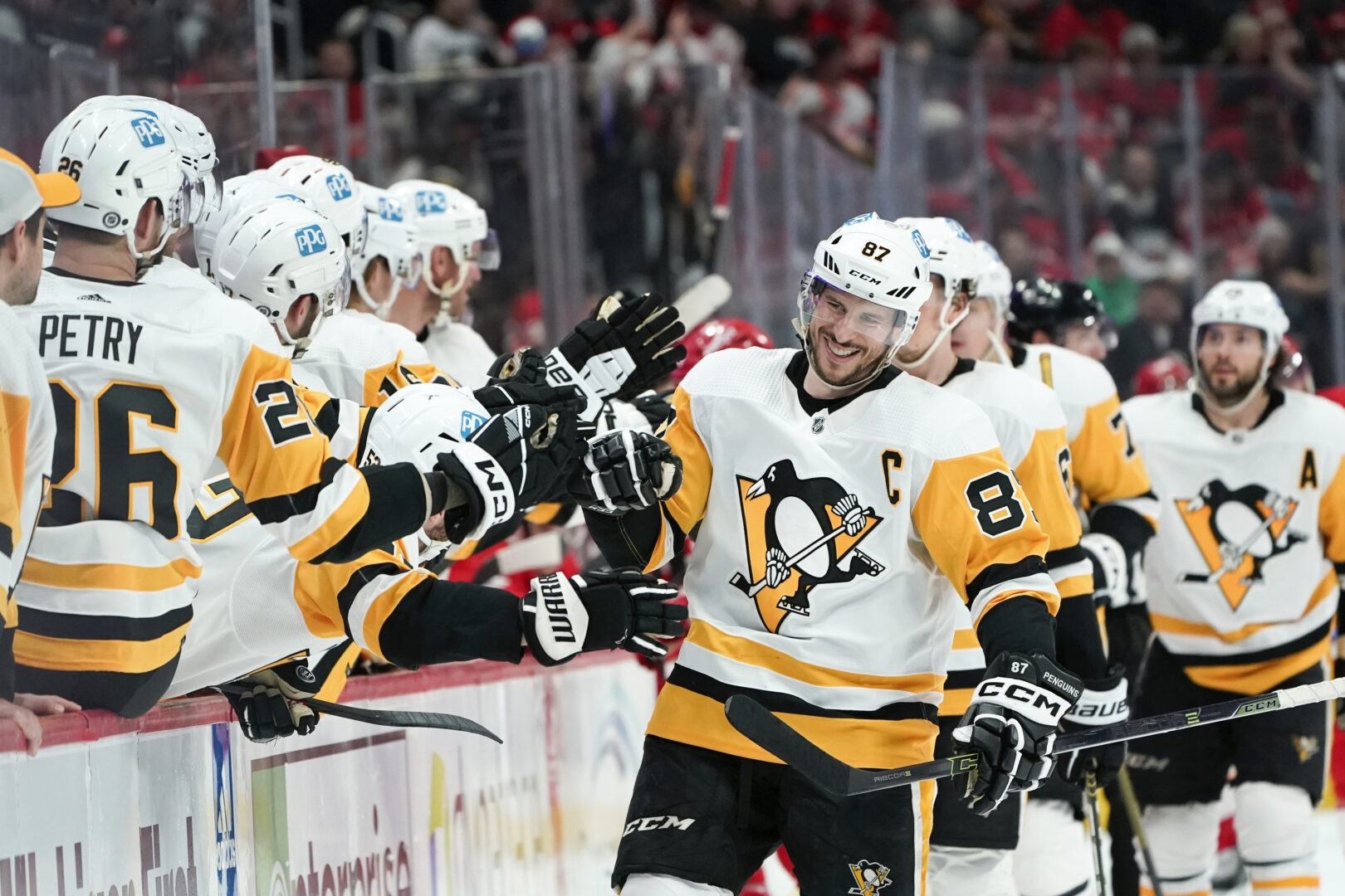 Pittsburgh Penguins center Sidney Crosby (87) smiles as he celebrates his goal against the Detroit Red Wings in the third period of an NHL hockey game Saturday, April 8, 2023, in Detroit. (AP Photo/Paul Sancya)
