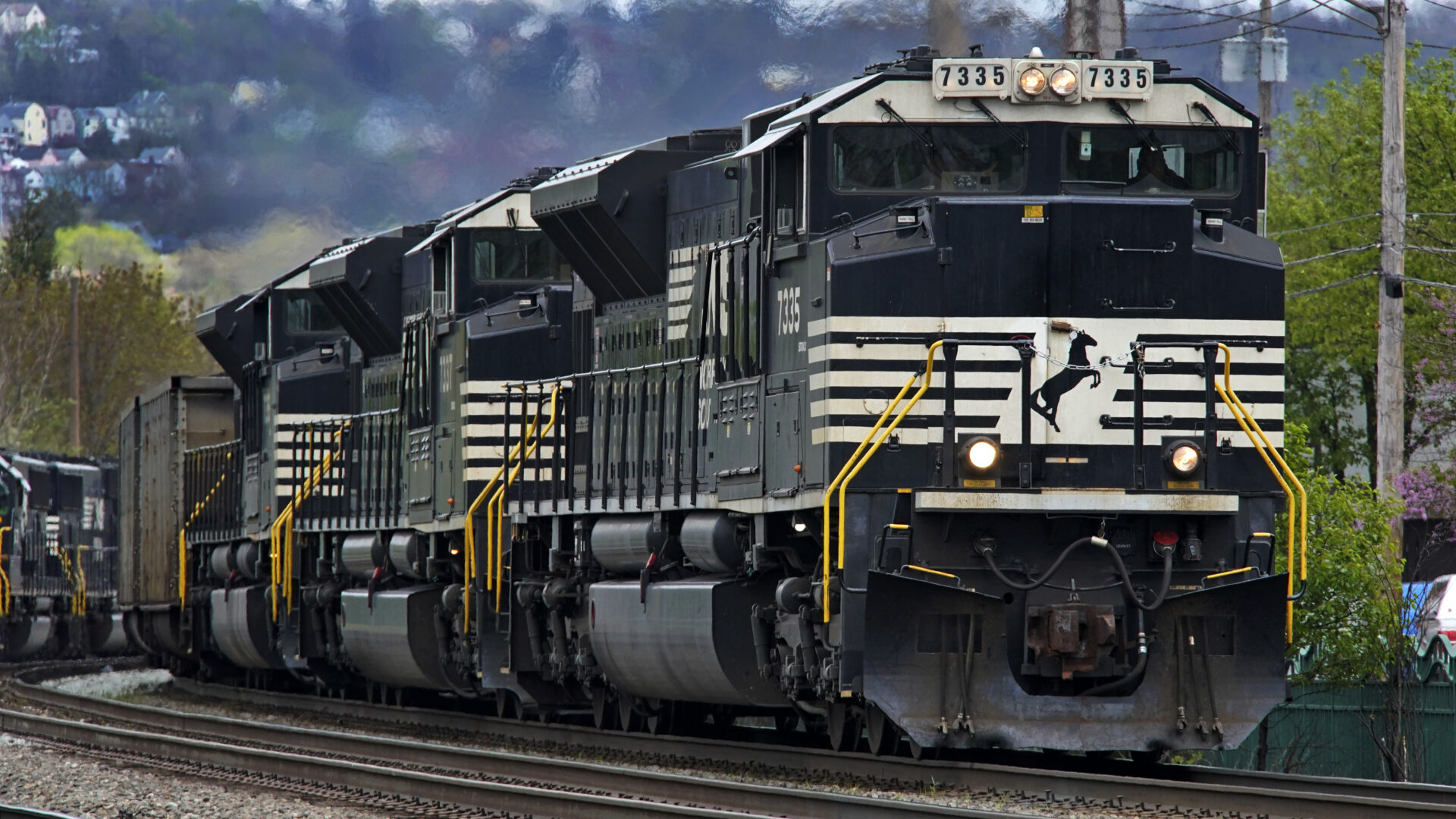 FILE - A Norfolk Southern freight train makes it way through Homestead, Pa. on April 27, 2022. Norfolk Southern reports earnings on Wednesday, April 26, 2023. (AP Photo/Gene J. Puskar, File)