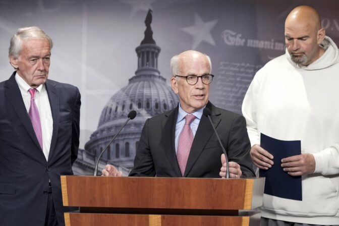 Sen. Peter Welch, D-Vt., center, speaks as Sen. Edward Markey, D-Mass., left and Sen. John Fetterman, D-Pa., right, listen during a news conference on the debt limit, Thursday, May 18, 2023, on Capitol Hill in Washington.