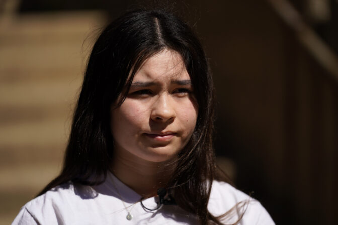 Upper Darby High School student Elise Olmstead, 16, pauses while speaking with a reporter during an interview in the campus