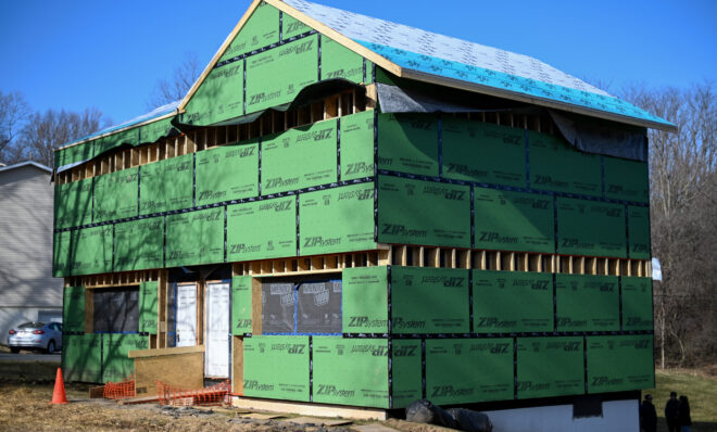 The State College Community Land Trust and Envinity are working to retrofit this home in State College into a highly energy efficient "passive house." They built an "envelope" around the exterior of the home that will be filled with insulation. (Jeremy Long - WITF)