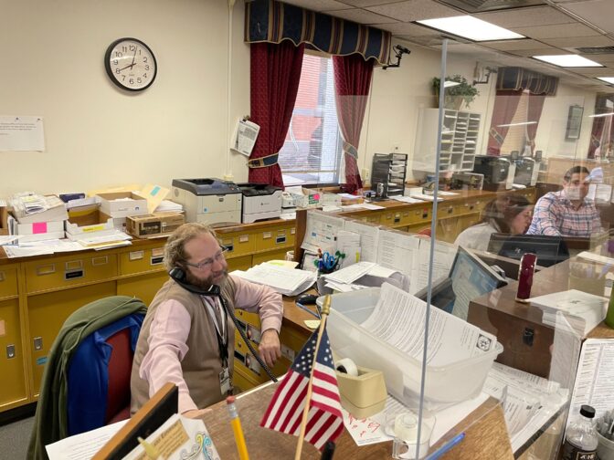 Columbia County Elections Director Matthew Repasky answers phones during the May 2023 municipal primary.