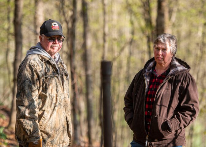 Cheryl and Joe Thomas with one of the dozens of abandoned wells on their Duke Center, Pa. property.