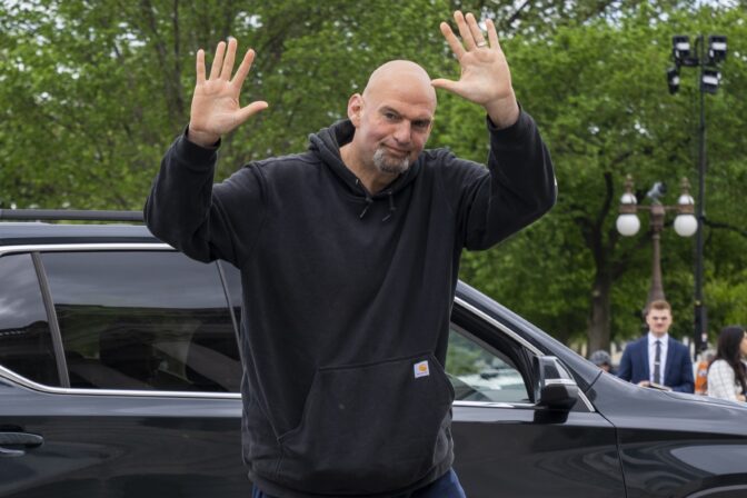 Sen. John Fetterman, D-Penn., waves to members of the media as he returns to the Capitol after seeking inpatient treatment for clinical depression Monday, April 17, 2023, on Capitol Hill in Washington.