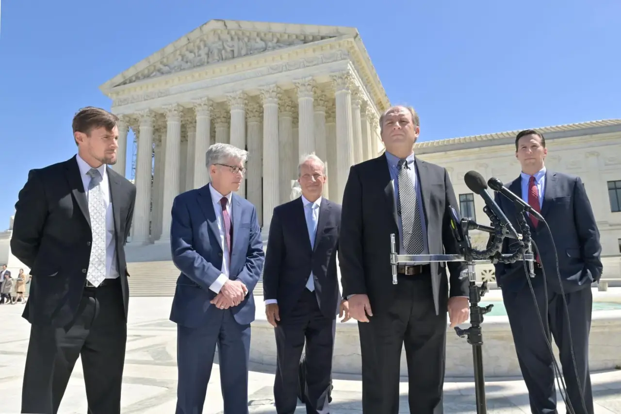 Attorneys Jeremy Samek, left, Randall Wenger, Kelly Shackelford and Aaron Streett, right, listen to Gerald Groff address the media after leaving the U.S. Supreme Court in Washington, D.C., on Tuesday, April 18, 2023.