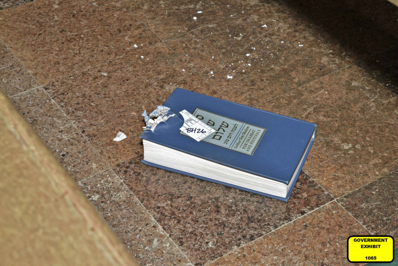 This image released by the Department of Justice. shows a bullet-damaged prayer book that was introduced as a court exhibit, Tuesday, May 30, 2023, in the federal trial of Robert Bowers in Pittsburgh, Bowers went on trial Tuesday more than four years after an attack on a Pittsburgh synagogue that killed 11 worshippers and wounded 7 others. Tree of Life Rabbi Jeffrey Myers testified Tuesday that the book serves as a “witness to the horror of that day.”