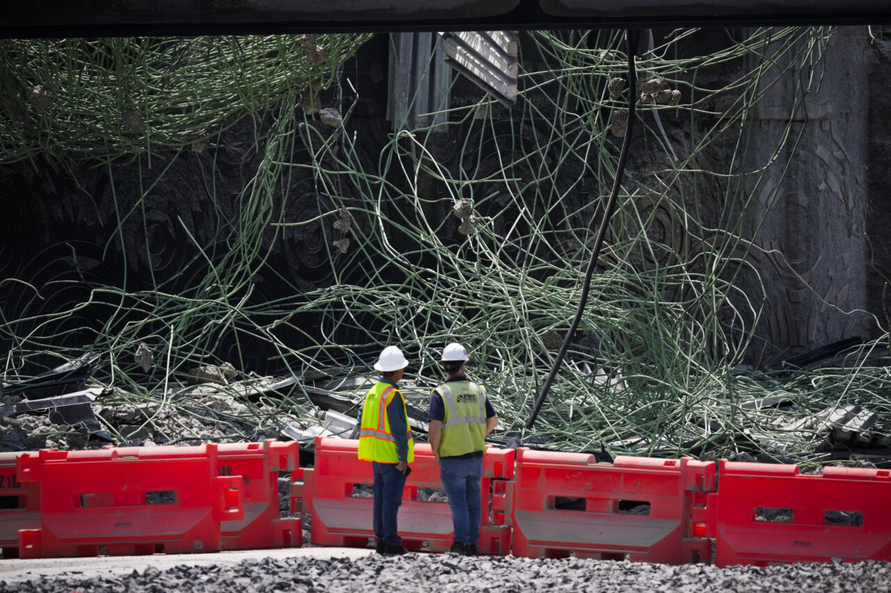 Peopleviews the scene of a collapsed elevated section of Interstate 95, Tuesday, June 13, 2023, in Philadelphia. (AP Photo/Matt Slocum)