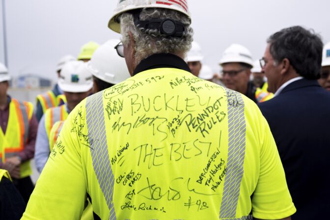 Robert Buckley, president of construction firm Buckley & Co., has his shirt signed during a news conference to announce the reopening of Interstate 95 Friday, June 23, 2023 in Philadelphia.
