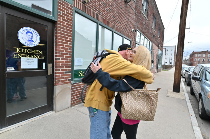 Ed hugs Pam Keefe outside the St. Vincent de Paul Kitchen in early April. Keefe gave him naloxone earlier this year. When he overdosed, someone used the medication to revive him.