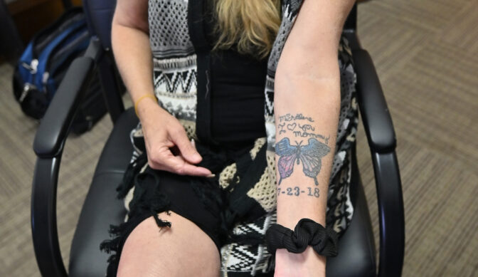 Pam Keefe shows the tattoo that honors her daughter, Michalene, who died due to a drug overdose.