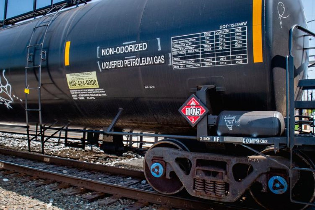 A railroad car labeled and placarded to be carrying liquified petroleum gas, moves on the railroad line along Front Street in Columbia Borough Wednesday, May 10, 2023.

